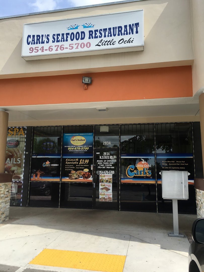 Restaurant entrance with Caribbean seafood signage.